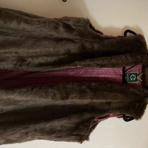 Brown faux fur vest never worn soft plush inside lining soft on clothes.